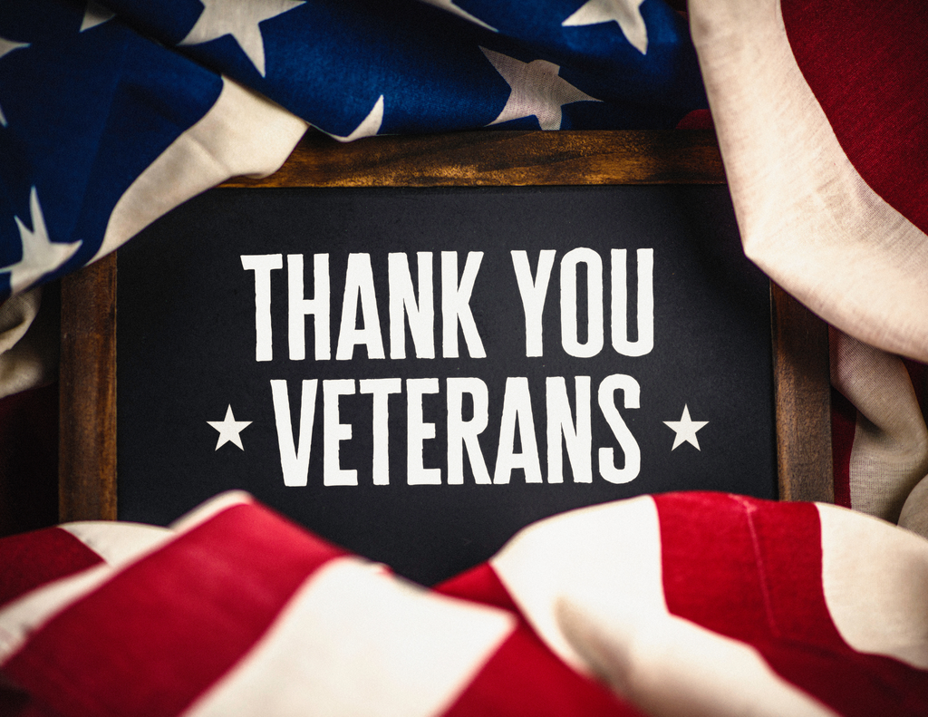 Flyer with picture of American Flag and Thank You Veterans on it.