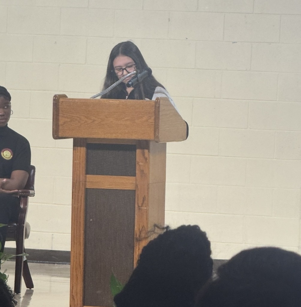 Student giving speech during Veterans ay Program.