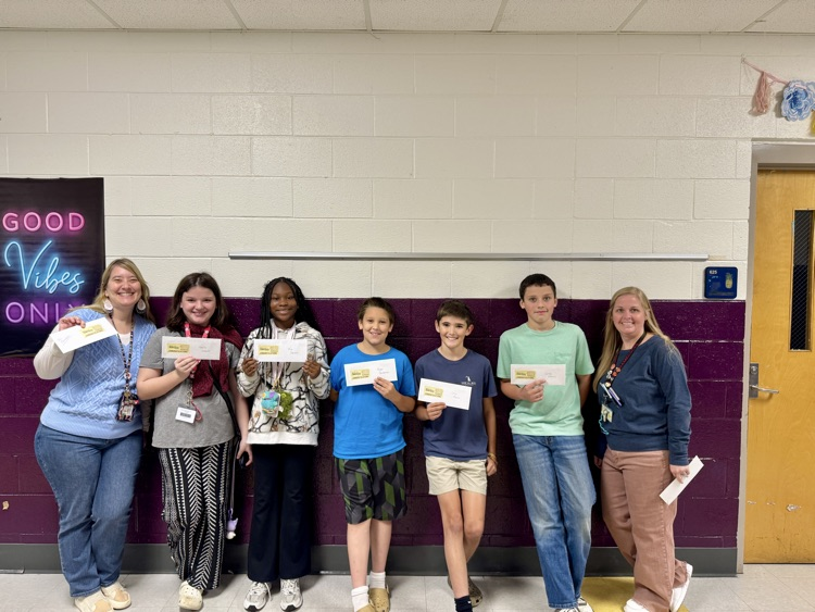 students posing with Gamecock tickets