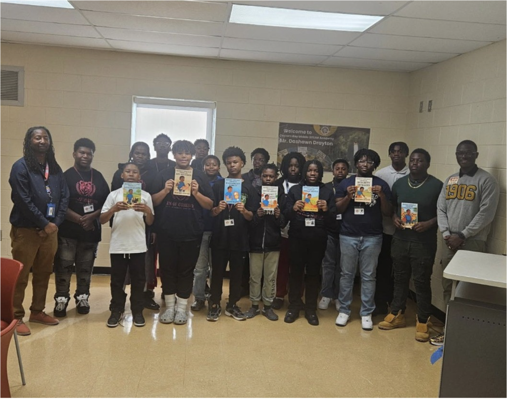Mr. Alston and students standing with author, Mr. Dashawn Drayton.