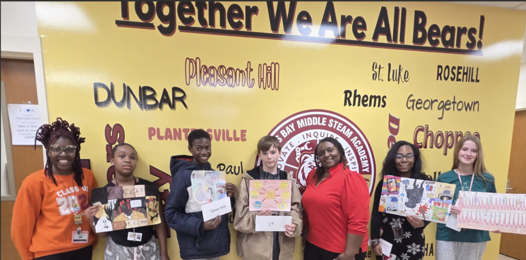 Art students contest winners along with the Art teacher and Principal Fraiser.