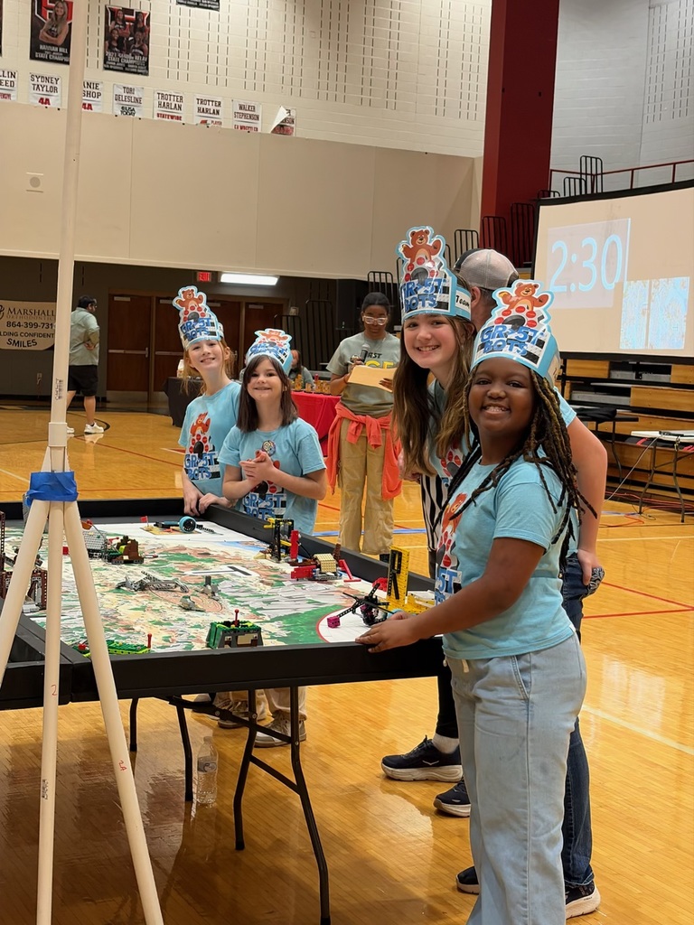 The smiling, happy faces of 4 of our Lego-Robotics students during the competition.
