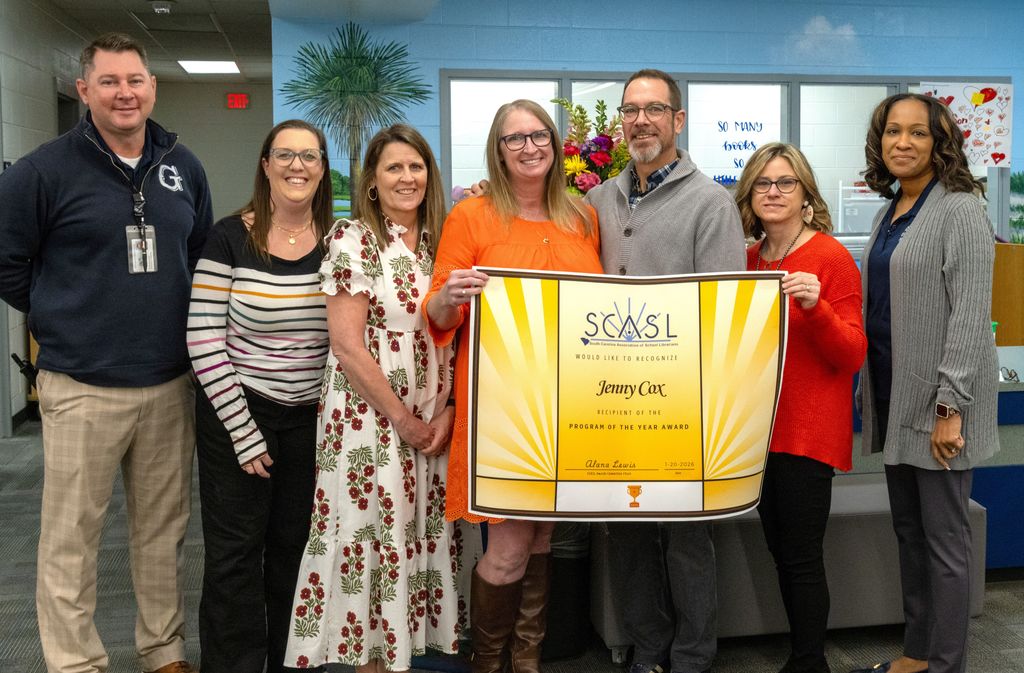 Cox (center) with GMS administration and GCSD Director of Special Programs