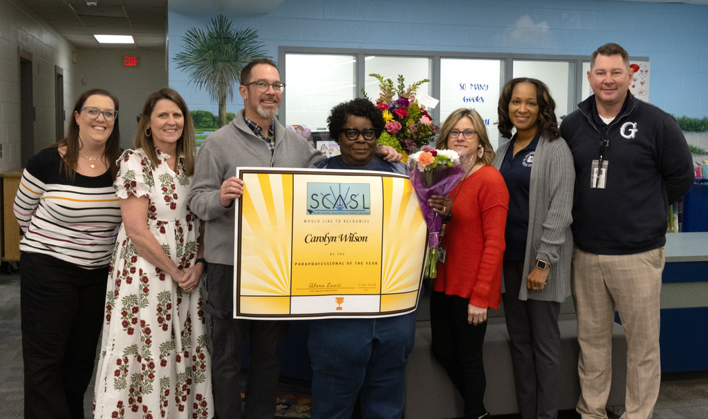 Wilson (center) with GMS administration and GCSD Director of Special Programs