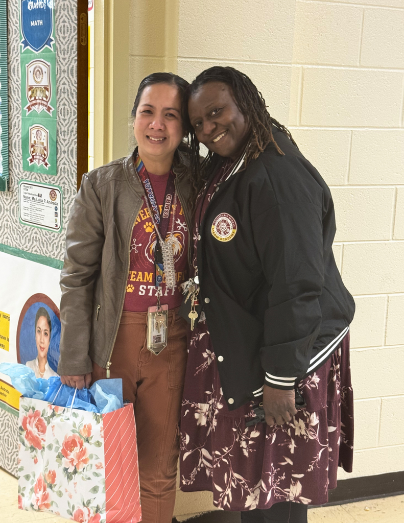 Teacher of the Year for 2026-2027, Mrs. MaLuisa Andrada standing with Principal Fraiser.