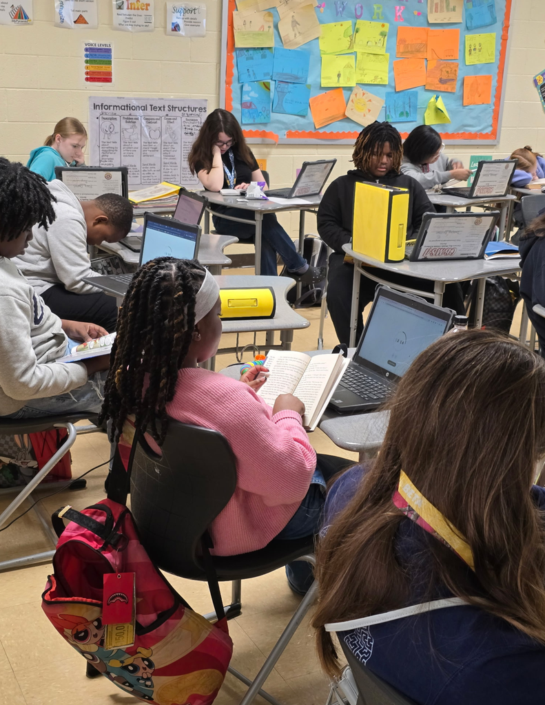 Carvers Bay Middle students are reading during the Read Across Georgetown Day.