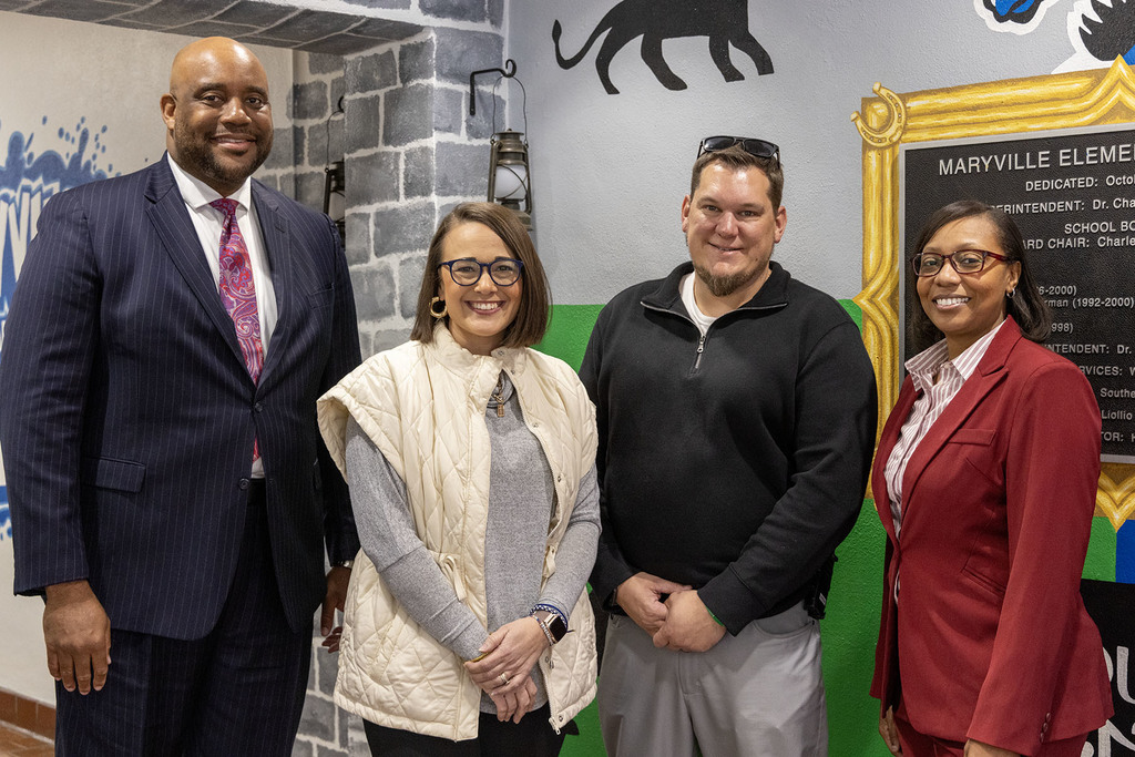 Maryville Elementary - Corey Baldwin (third from left) with District and school administration