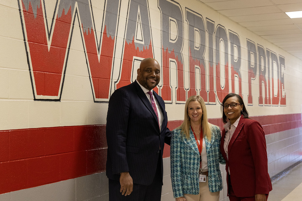 Ginny Haynes, center, pictures with District administration