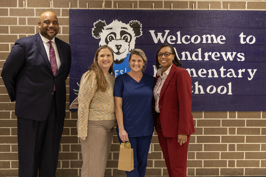 Andrews Elementary - Lindsay Cox (second from right) pictured with District and school administration