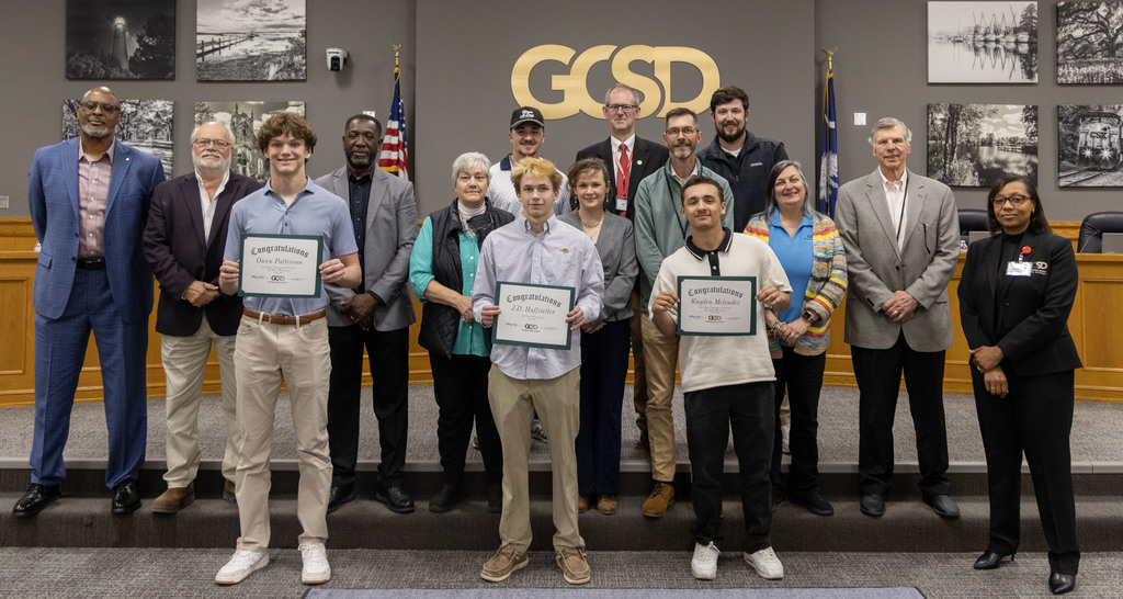 WHS State Champion and All-State Wrestlers (holding certificates) pictured with the GCSD Board of Trustees, Superintendent Bethany Giles, team coaches and WHS principal Dr. David Hammel
