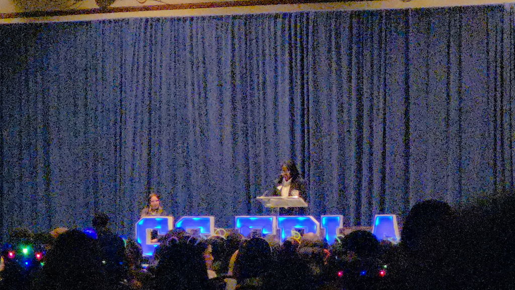 Student presenting at a podium.