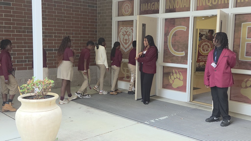 5th graders being guided into our school.
