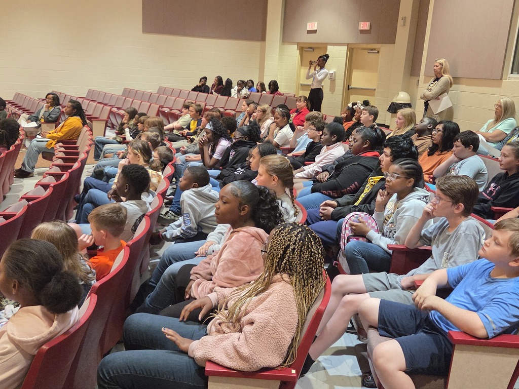 5th grade students sitting in the School Auditorium.