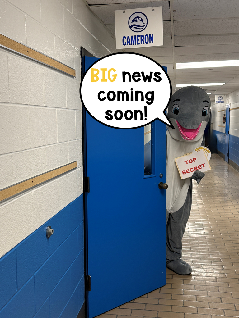 Dolphin mascot peeks around the principals office door holding a "Top Secret" folder with a speech bubble asking, "Can YOU guess the secret?"