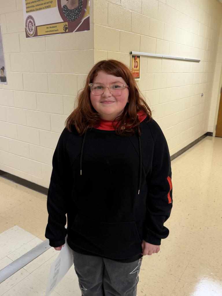 New sixth grade student standing in the hall
