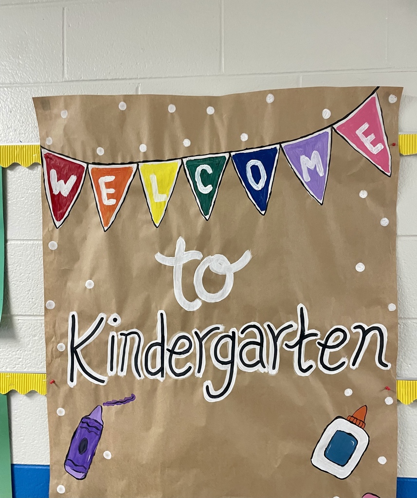 Hand-painted “Welcome to Kindergarten” classroom sign.
