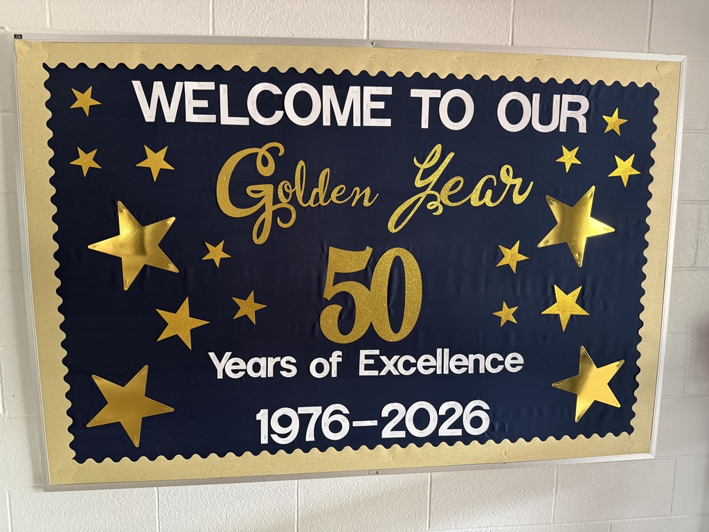 Golden Year 50th anniversary bulletin board with gold stars.