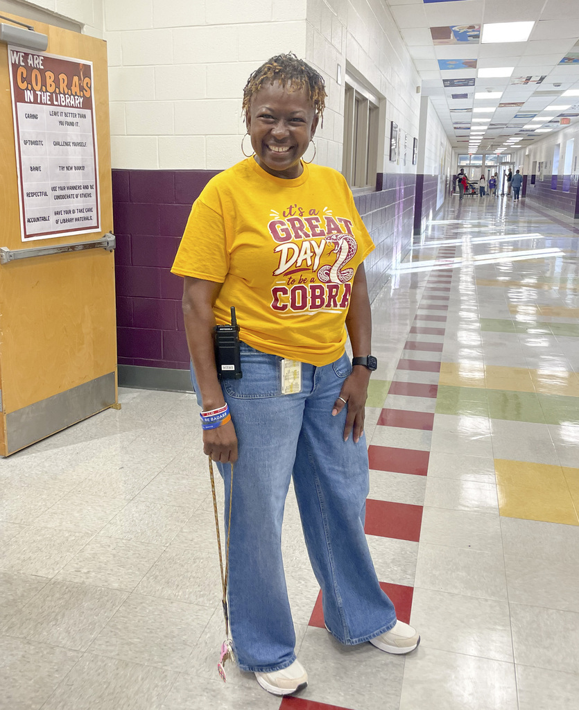 RMS teachers pose wearing Great Day shirts