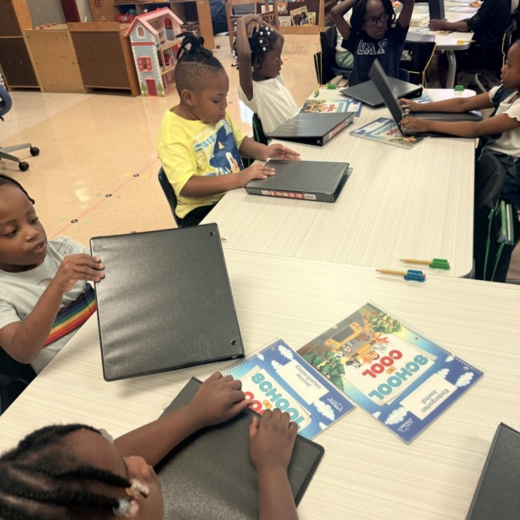 kindergartners setting up binders