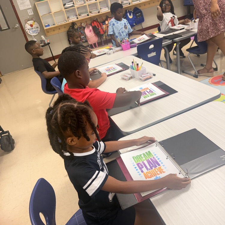 1st graders at BFESCPA setting up Binders