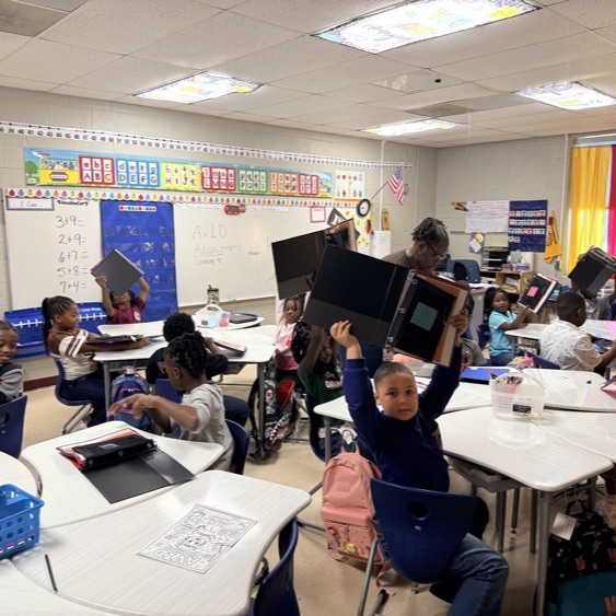 2nd graders at BFESCPA setting up binders
