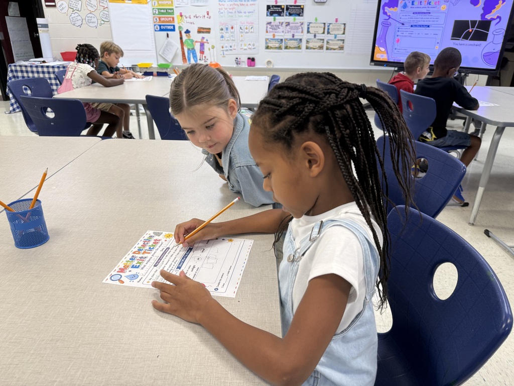 Ms. Lewis's 2nd graders identifying types of matter. 1