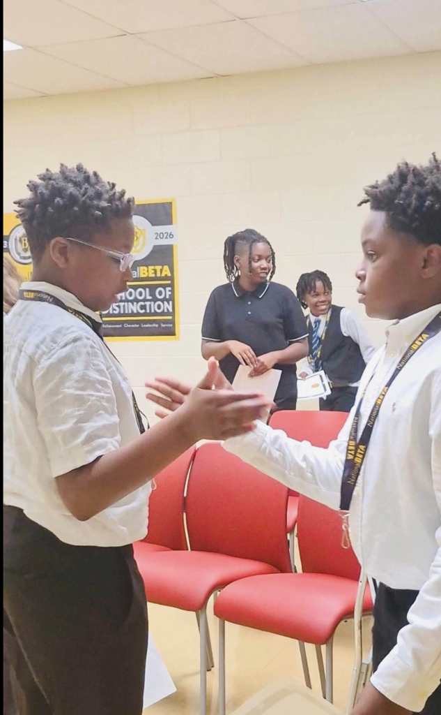 Beta Club Inductees congratulating each other