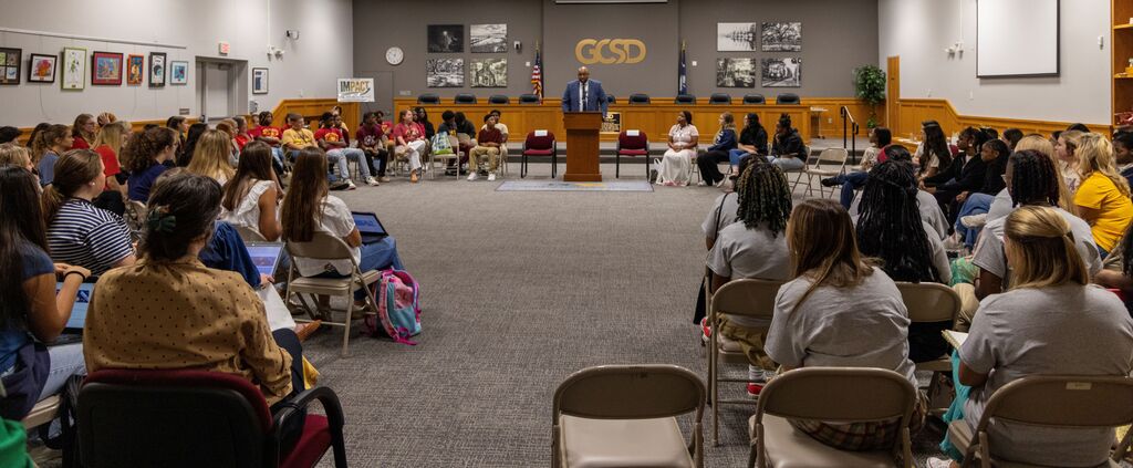 Pro Team students and Teacher Cadets from GCSD's high schools and middle school listening to introduction from Mr. Kalu Kalu, Chief Human Resources Officer