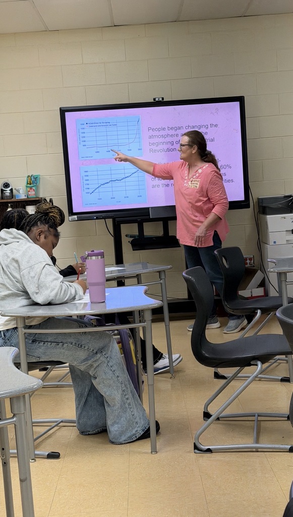 Ms. Mulligan explaining recycling to the class.