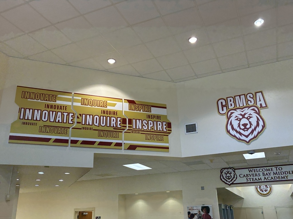 Innovate, Inquire, Inspire sign located in hallway at CBMSA
