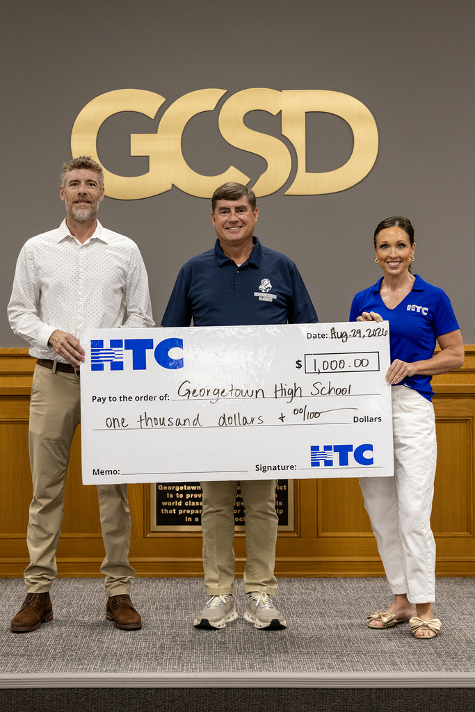 Brian Clark, APA for GHS, accepts the donation from HTC.