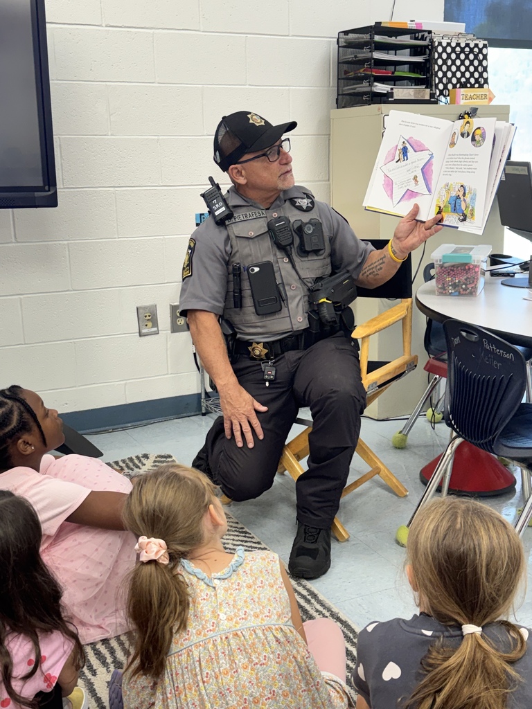 Deputy Dan Pietrafesa reads to students at Waccamaw Elementary.