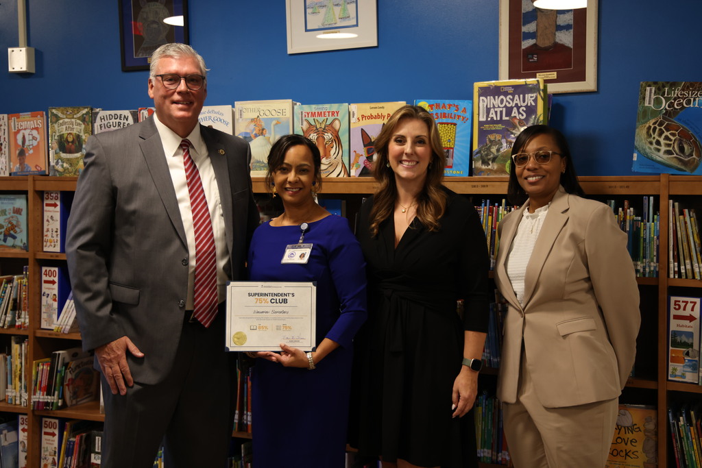 Sheriff Weaver, WES Principal Ashley Cameron, State Superintendent Ellen Weaver, and GCSD Superintendent Dr. Bethany A Giles pose in the media center at Waccamaw Elementary.