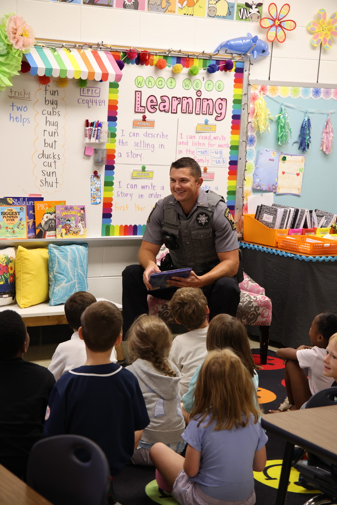 Lieutenant Brett Kowalewski reads to students at Waccamaw Elementary.
