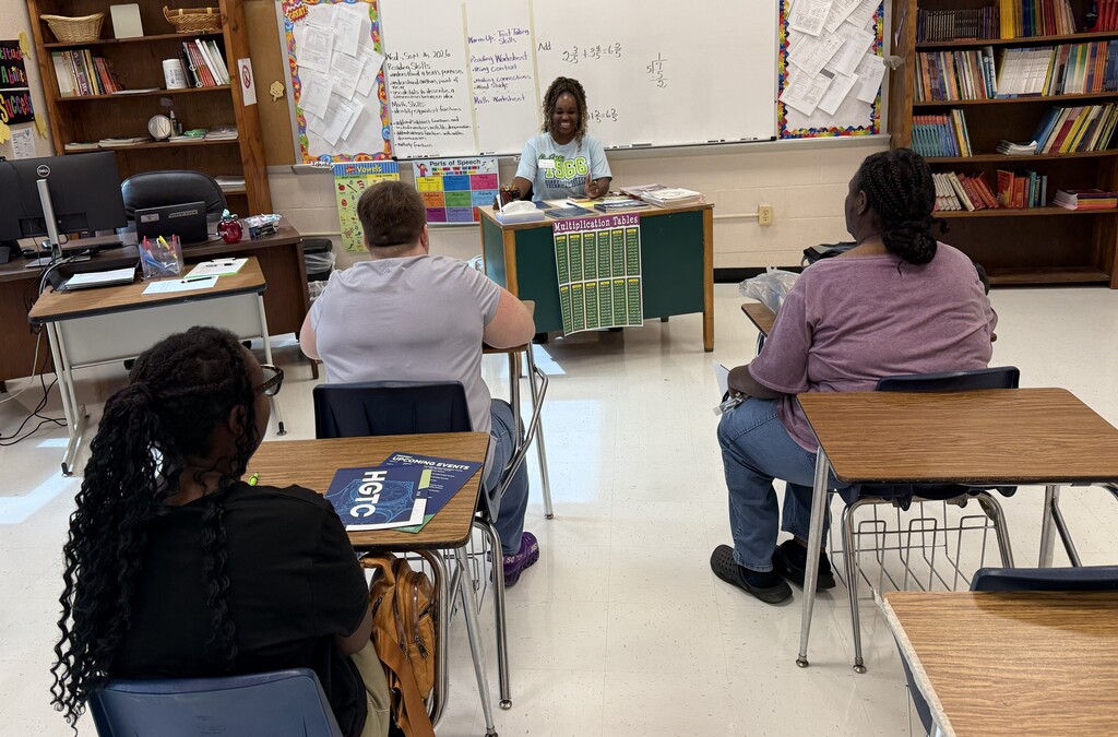 Students seated around tables in a classroom engaging in the Horry Georgetown Technical College presentation.