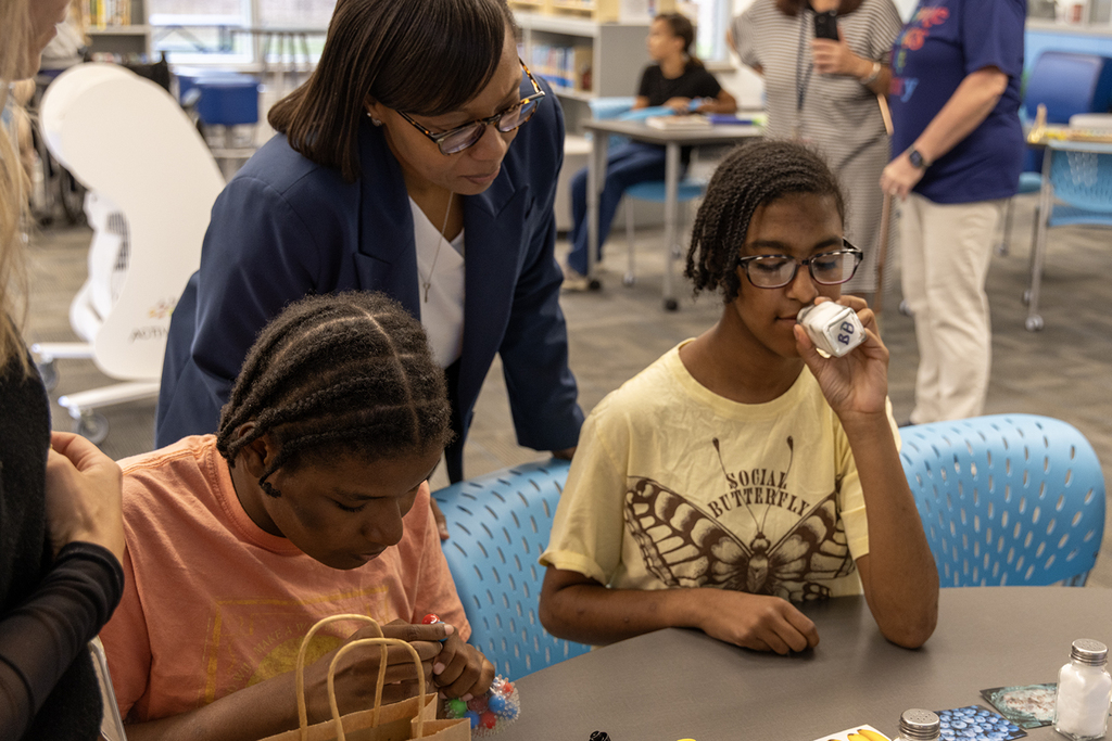 Dr. Giles interacts with students at GMS's sensory museum.