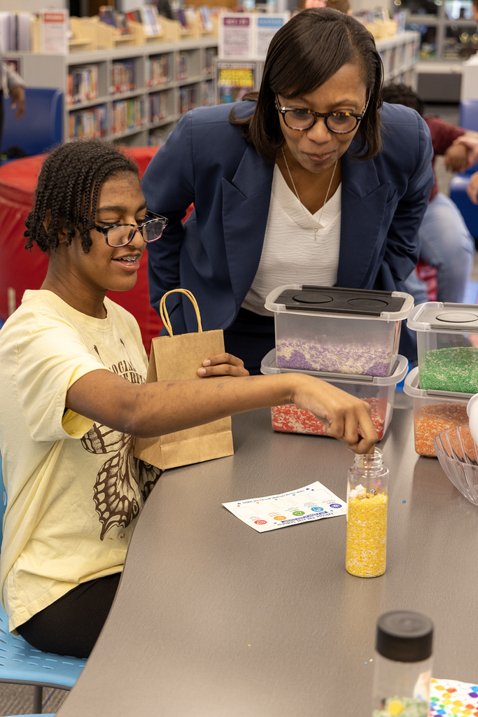 Dr. Giles interacts with students at GMS's sensory museum.