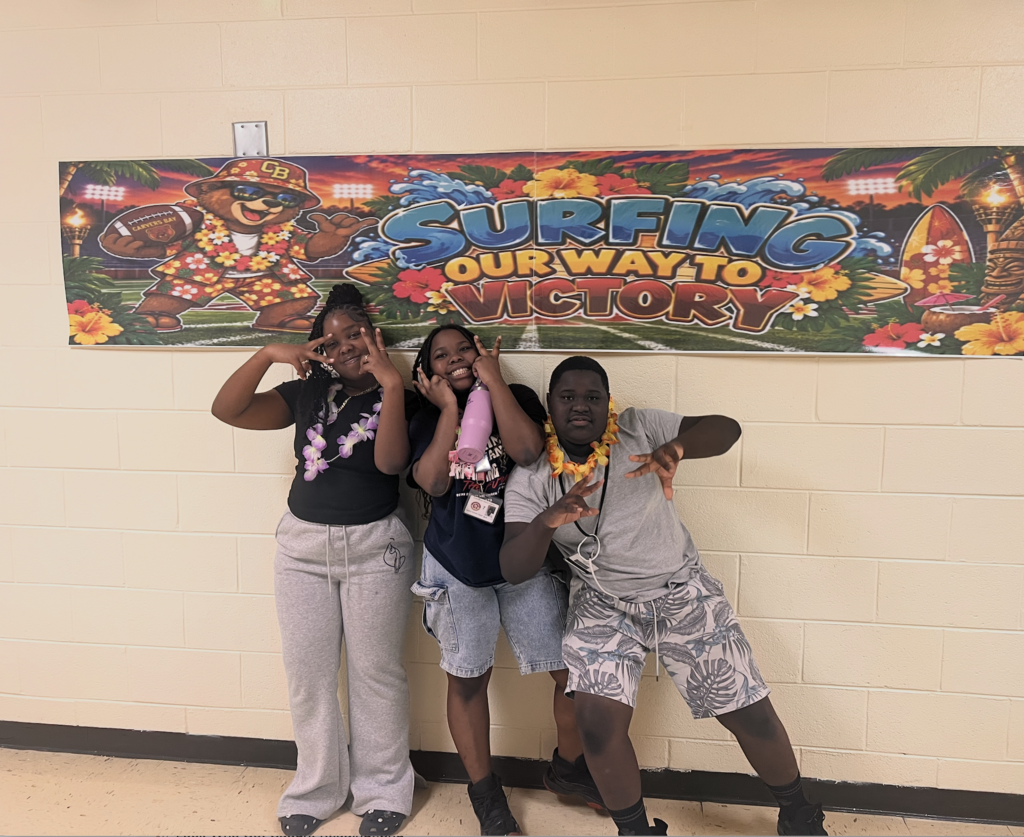 Students and football players sporting a Hawaiian themed football gamed day at CBMSA