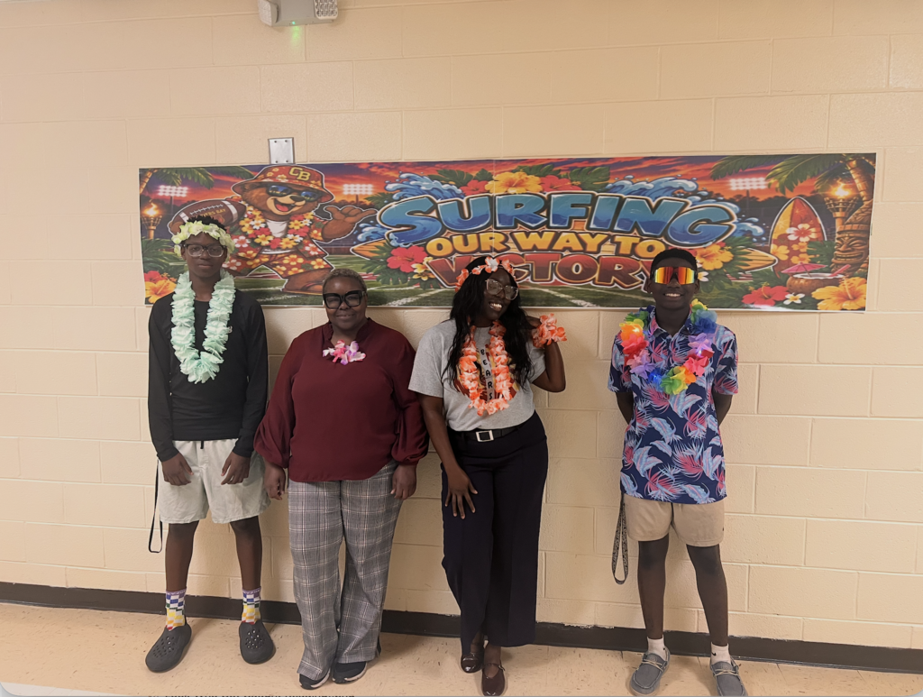 Students, teachers,  and football players sporting a Hawaiian themed football gamed day at CBMSA