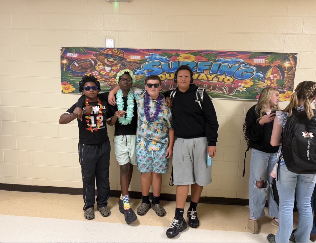 Students and football players sporting a Hawaiian themed football gamed day at CBMSA