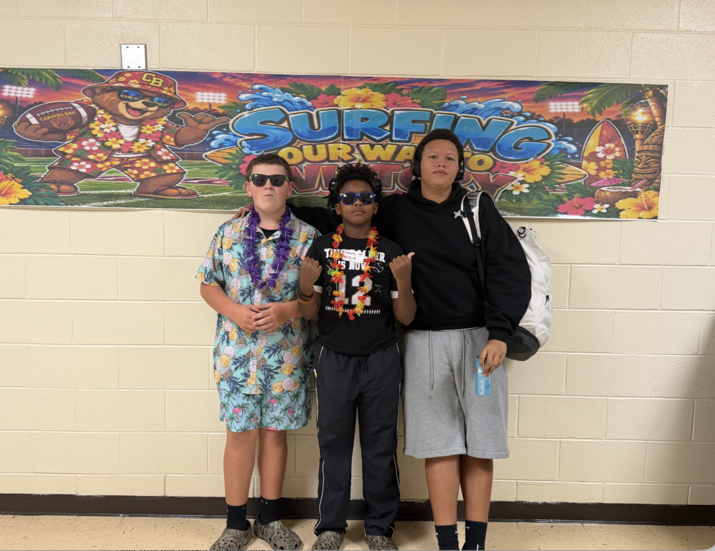 Students and football players sporting a Hawaiian themed football gamed day at CBMSA