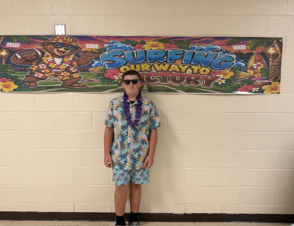 Students and football players sporting a Hawaiian themed football gamed day at CBMSA