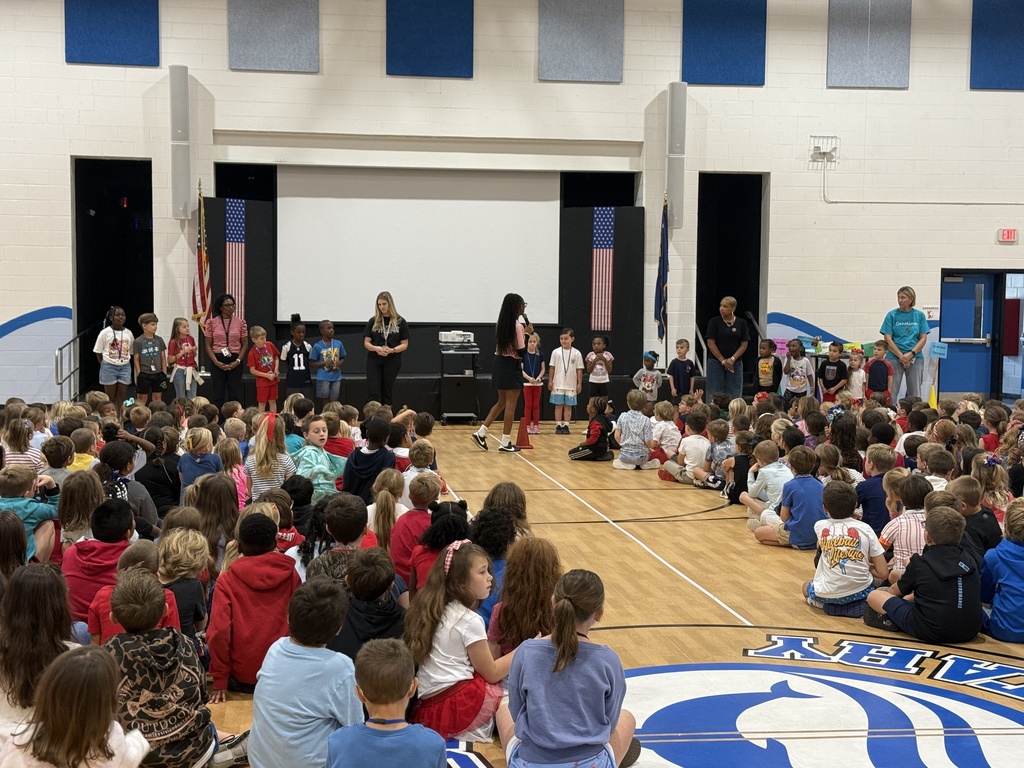 Melissa Jefferson-Wooden speaks with students during the schoolwide assembly in the Waccamaw Elementary gym.