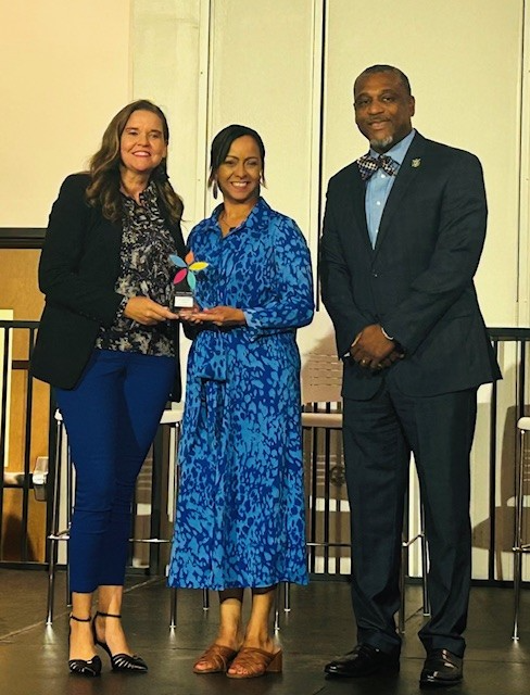 Dr. Strickland, Ashley Cameron, and Mack Burgess accept the award on behalf of GCSD.