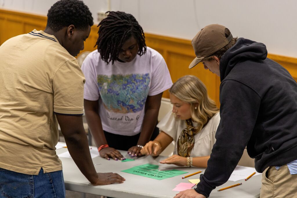 Members of the Superintendent's Student Advisory Council completing a GCSD Vision puzzle