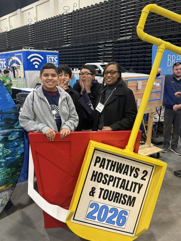 Students pose with Superintendent Giles.