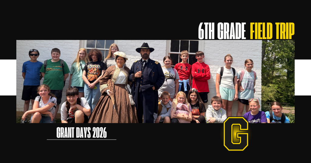Image of 6th grade students with reenactors of Ulysses S. Grant and his wife from their field trip to Grant Days.