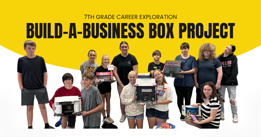 Image of students holding build-a-business box projects from the 7th grade career exploration course.