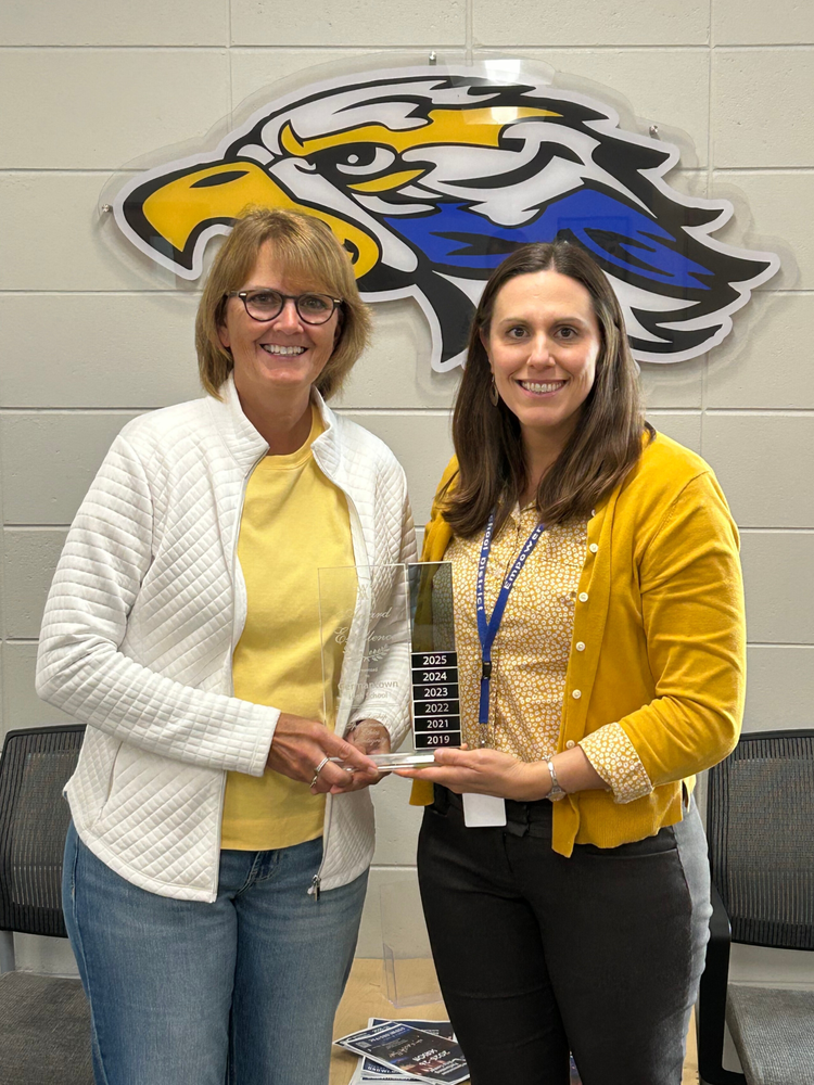 Pictured with the award are Activities Director Sara Unertl and Activities Assistant Diana Heinz.