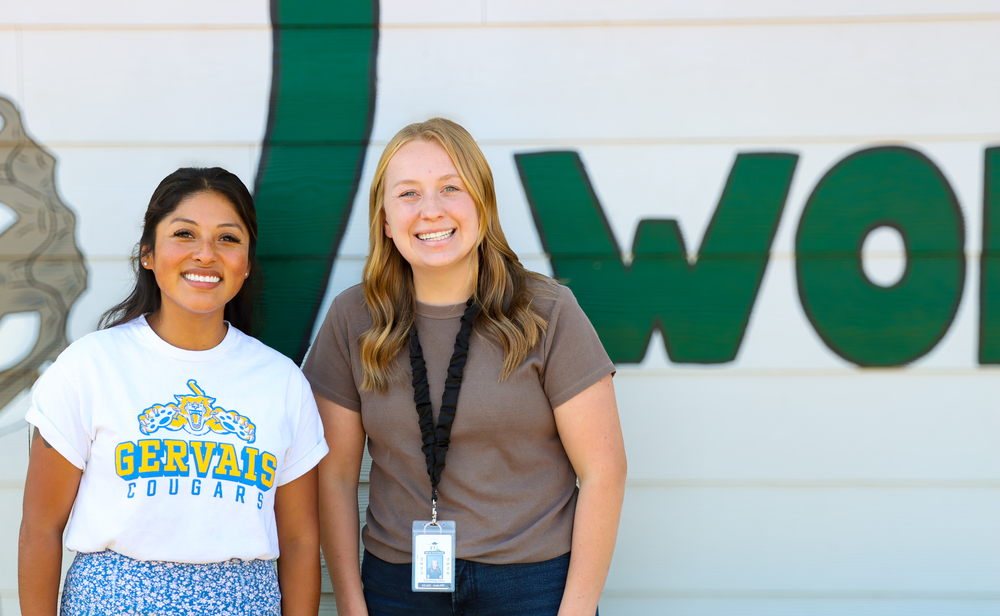 two teachers smiling